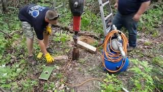 Driving a sandpoint well with a jackhammer [upl. by Suckram]